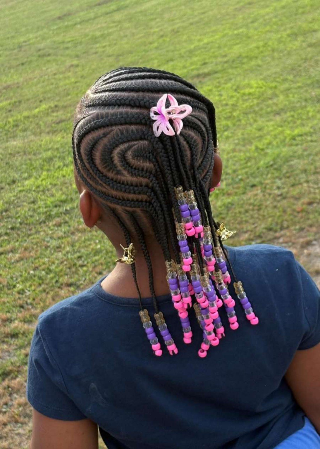 Progress view showing a child's retained hair styled in braids